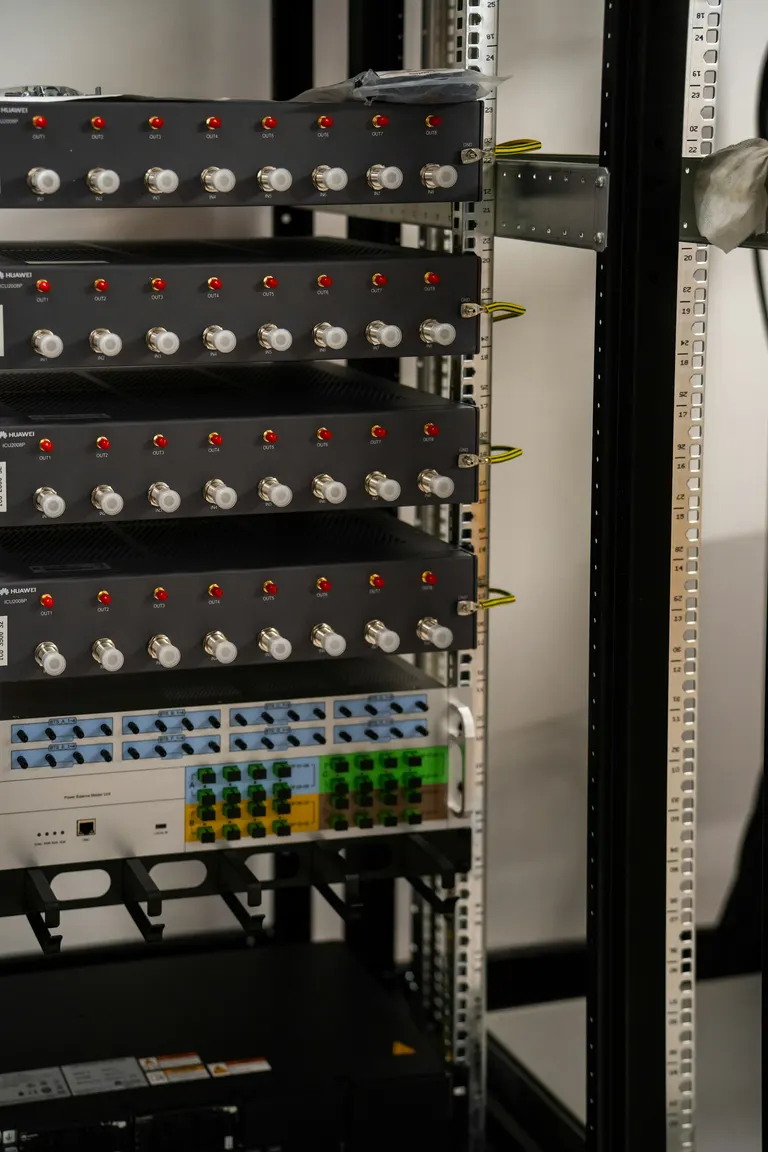 Server racks with network cables in a data center — IT support and networking by Chama Solution