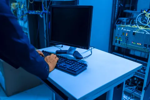 IT technician working with servers in a data center